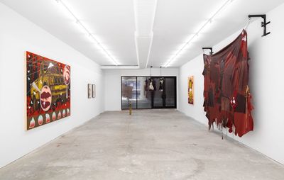 installation view of several large artworks hung on white walls