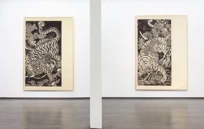 installation view of two large monochrome artworks by Kour Pour hung on a white wall separated by a white pillar