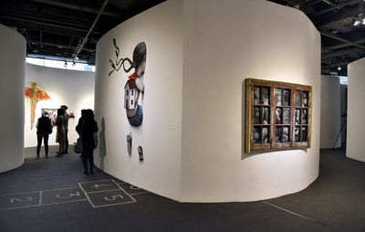 Artwork displayed in a gallery space, on the wall and on the floor