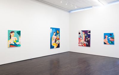 Four paintings of nude women all hanging on a plain white wall in a gallery