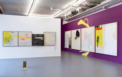 installation view two walls, one purple and one white, each with four paintings on