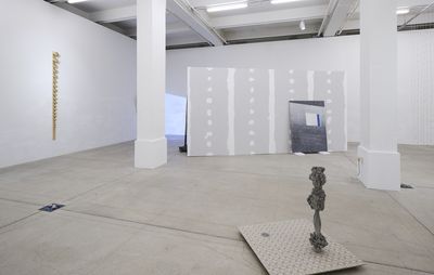 installation view of several sculptures in a white gallery setting