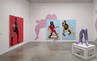 galley space with three large paintings, a pink mural and a pair of metallic lilac legs standing on a white plastic crate