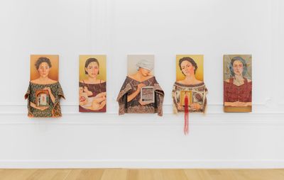 installation view of five similar portrait paintings all with varying subjects lined up against a white wall