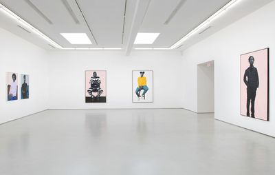 installation view of a white exhibition space with five large figurative paintings hung up