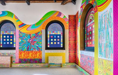 brightly coloured installation of stained glass windows and colourful patterns