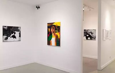 installation view of two paintings by TIDE hung on separate walls, alongside a painting by another artist