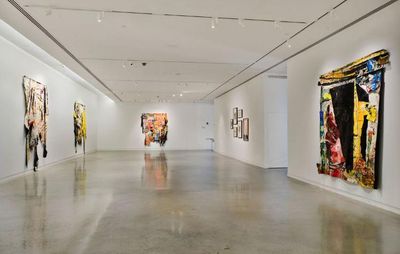 installation view of long white exhibition room with five large oil skin paintings hung up