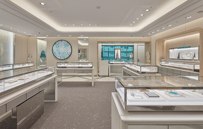 Beige and white shop layout, glass cabinets on display