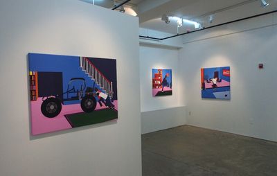 Three paintings hanging in a gallery space