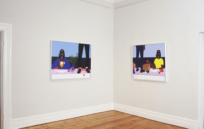 Two paintings hanging in a gallery space, wooden floorboards