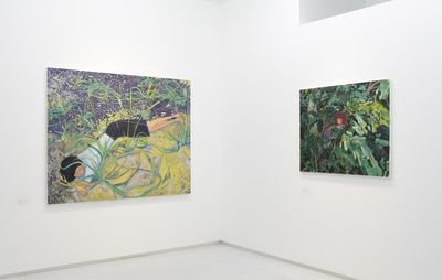 installation view of two paintings of single figures in foliage 