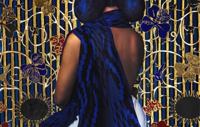 painting of a woman draped in blue fabric facing away from the viewer, looking towards an ornate gold-patterned background