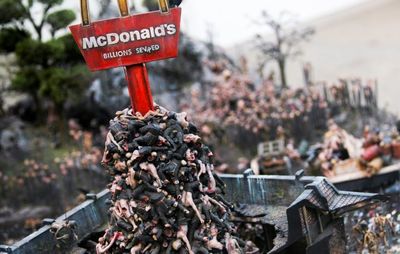 a pile of bodies amounts under a red McDonald's sign
