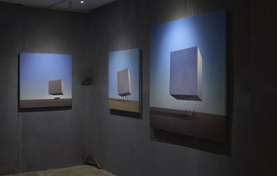 installation view of three paintings hung of the same image but varying sizes