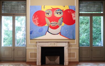 installation view of a large painting above a fireplace