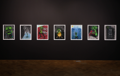 installation view of a dark gallery wall with seven paintings hung and aligned