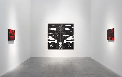 installation view of a large monochrome painting and two smaller paintings on adjacent walls