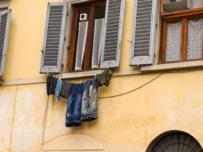 Washing hanging from apartment windows in Florence