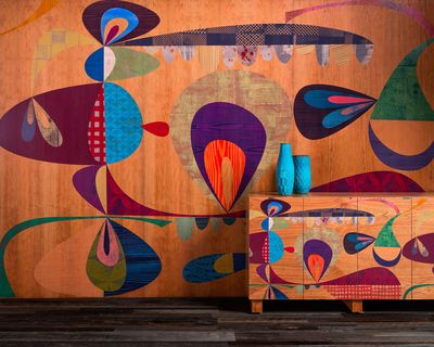 Colorful patterned wooden Infused Veneer wall stands behind a cabinet with the same patterning as the wall.