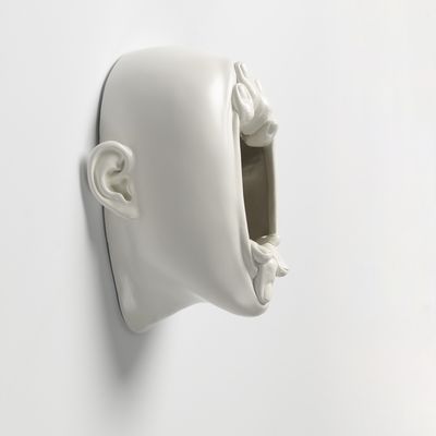  Sculpture of stretched open face with mirror inside, Lucid Dream II by Johnson Tsang