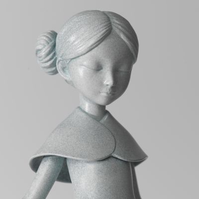 Bronze sculpture with blue/grey flecked patina of girl holding maze, Maze by James Jean - detail shot