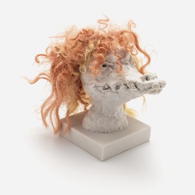 a sculpture of a crocodile head with a custom hair piece in ginger, Nathalie Djurberg & Hans Berg