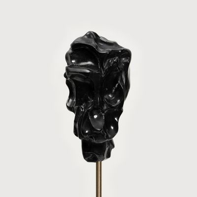 black marble sculpture on a steel stick by Kevin Francis Gray