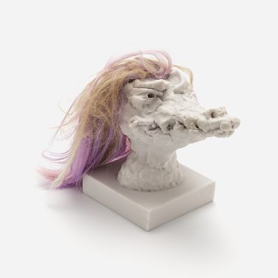 a sculpture of a crocodile head with a custom hair piece in yellow and purple, Nathalie Djurberg & Hans Berg