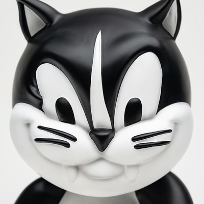 devilish face of black and white cat sculpture