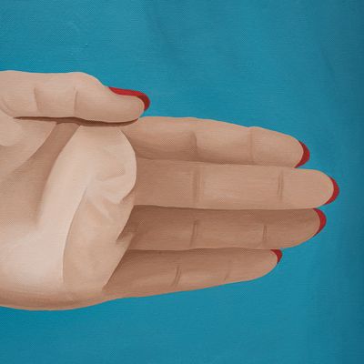 Hand with red nails on blue background