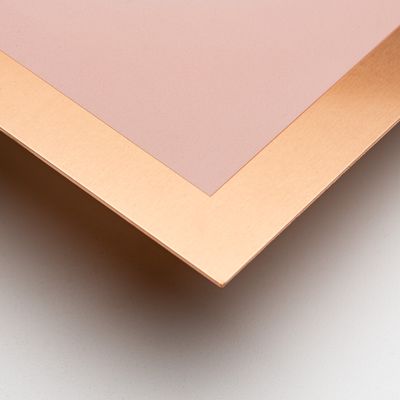 a close-up of a green and pink minimalist print edition by Jonny Niesche in a bronze frame