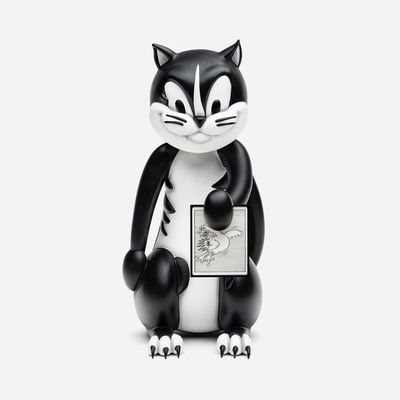 devilish black and white cat sculpture looking at camera