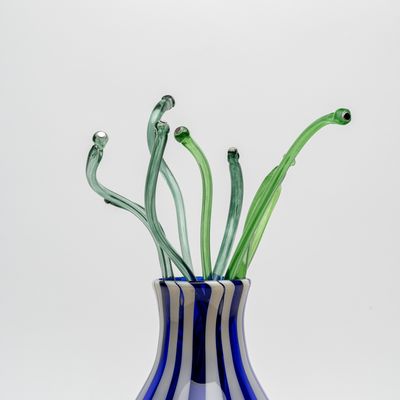 Striped glass vase with glass green stalks