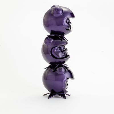 a purple sculpture of three heads in custom helmets stacked on top of each other by Hebru Brantley - side view