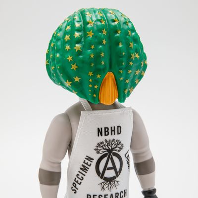 close up shot of vinyl figurine with oversize green cactus-shaped head