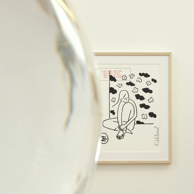framed print, partially-obscured by a round fishbowl