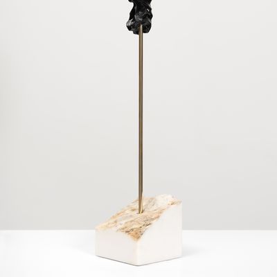 black marble sculpture in an organic shape on a bronze pole by Kevin Francis Gray - side view