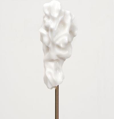 white marble sculpture in an organic shape on a bronze pole by Kevin Francis Gray - close up