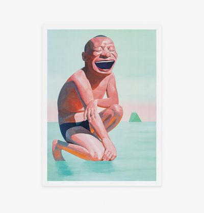 a laughing man kneeling down into the sea