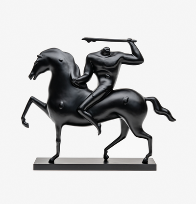 bronze sculpture of a black horse and warrior