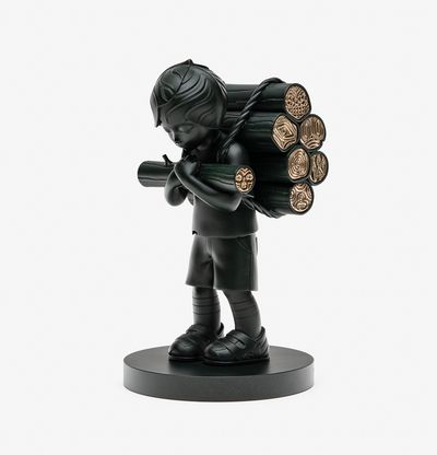 Bronze woodcutter holds a log infront of him