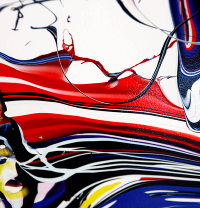 detail of a print of swirling colours on a white background