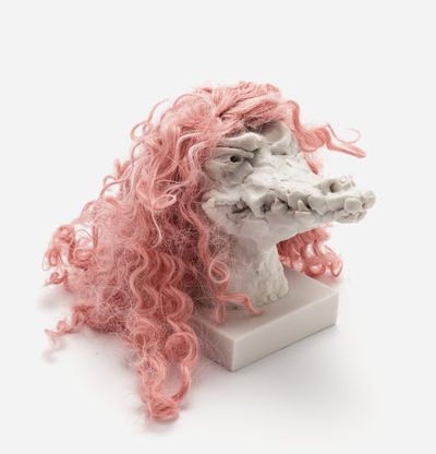 a sculpture of a crocodile head with a custom hair piece in cherry pink, Nathalie Djurberg & Hans Berg
