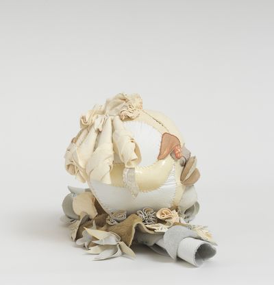 Soft sculpture of leather and cloth, Moon by Tau Lewis