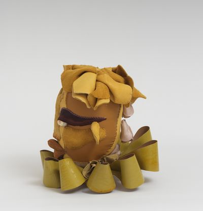 Soft sculpture of leather and cloth, Olivine by Tau Lewis