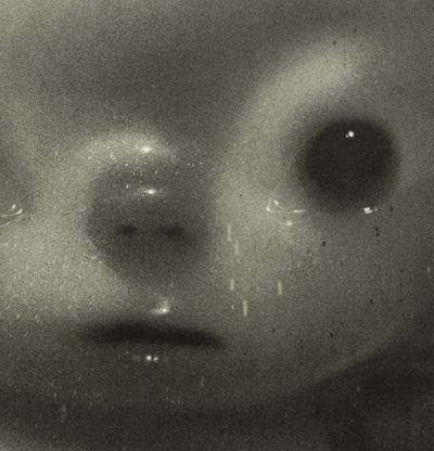 detail of a child-like monochrome portrait