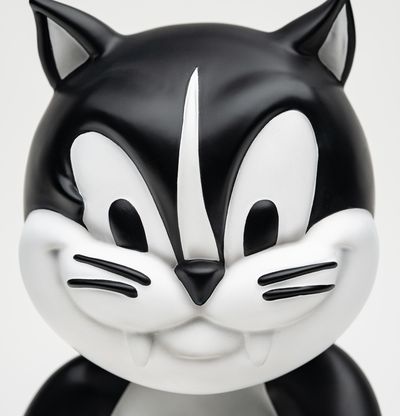 devilish face of black and white cat sculpture