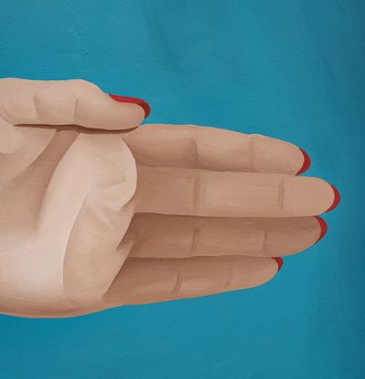 Hand with red nails on blue background