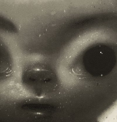 detail of a wide-eyed greyscale portrait
